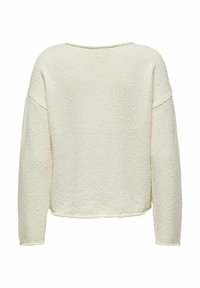 Kermansiniselle sävyinen neulepaita, teksturoitu kangas, väljä istuvuus, leveä kaula-aukko, pitkät hihat ja kaareva helma takana.