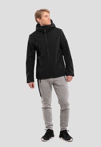 Luhta EDIS - Softshell-takki - schwarz