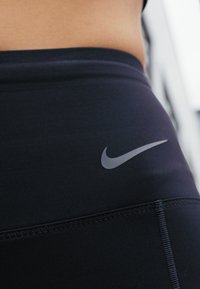 Nike Performance W NK DF GO MR 7/8 TGHT - Leggings - black