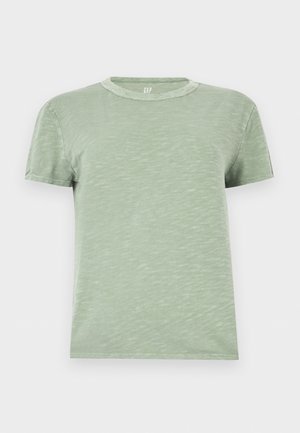 T-shirt vert clair à manches courtes avec col rond et texture subtile, présenté sur un fond blanc uni.