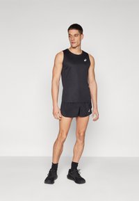 Black athletic tank top and shorts set, featuring a smooth fabric texture, slim fit, and logo detailing on the chest and shorts.