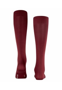 Calze al ginocchio di un ricco bordeaux, realizzate in materiale morbido con una finitura a costine sulla parte superiore. Nessun motivo visibile o dettagli in metallo.