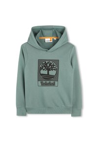 Sweatshirt à capuche verte en tissu texturé avec un logo d'arbre noir à l'avant. Comprend une poche kangourou et des poignets côtelés.