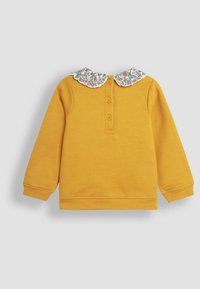 Pullover giallo senape con maniche lunghe, dotato di un colletto scallop a fantasia floreale e una chiusura a tre bottoni. Tessuto in cotone morbido.
