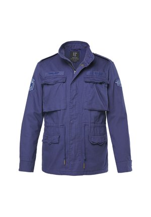 Marineblaue Jacke mit Reißverschluss vorne, zwei Brusttaschen und zwei unteren Taschen. Mit Schulterklappen und gestickten Abzeichen.
