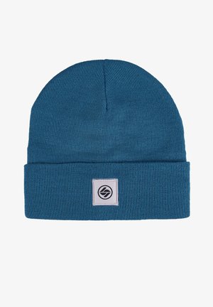 Blue knitted beanie hat featuring a folded cuff, textured fabric, and a square logo patch in black and white on the front.