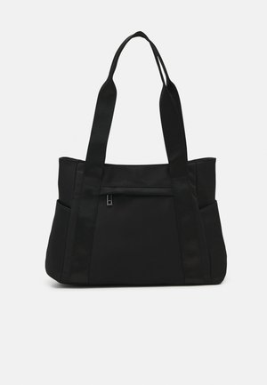 Black tote bag made of durable fabric with two long handles, a zippered front pocket, and side pockets for additional storage.