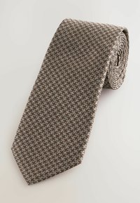 Ruskea ja sininen kuvioitu solmio, jossa on houndstooth-kuvio, teksturoitu kangas ja perinteinen kapeneva muoto, rullattuna yksityiskohtien näyttämiseksi.