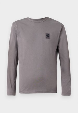 Långärmad grå t-shirt i mjukt material, med en liten svart logotyp på bröstet och rundad halsringning. Enkelt design utan mönster.