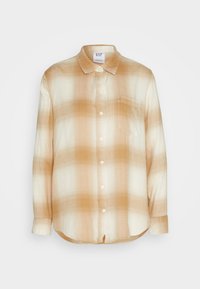 Camisa de cuadros en tonos beige y crema, con botones, de manga larga, dobladillo curvado y textura suave. Presenta un cuello redondeado y cinco botones en la parte delantera.