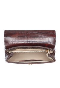 Crocodile-embossed brown leather clutch with a flap closure, gold-tone hardware, and a beige interior featuring a zip pocket and card slots.