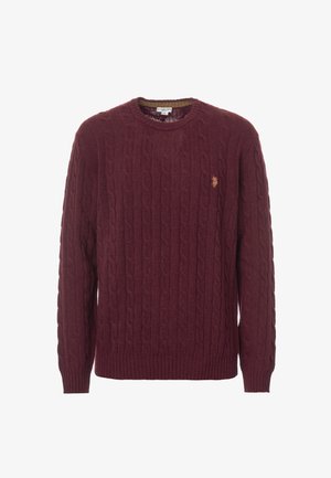 Maglione a maglia a coste color borgogna con colletto rotondo, polsini e orlo a coste. Presenta un piccolo emblema dorato sul petto. Texture morbida.