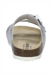 Silver leather sandal with a back strap and cork sole. Smooth upper surface and textured insole. Adjustable metal buckle detail.