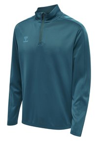 Sudadera de medio cierre en color azul cian, con mangas largas, fabricada en material sintético suave. Presenta un cuello con cremallera, con el logo en el lado izquierdo del pecho y rayas en los laterales.