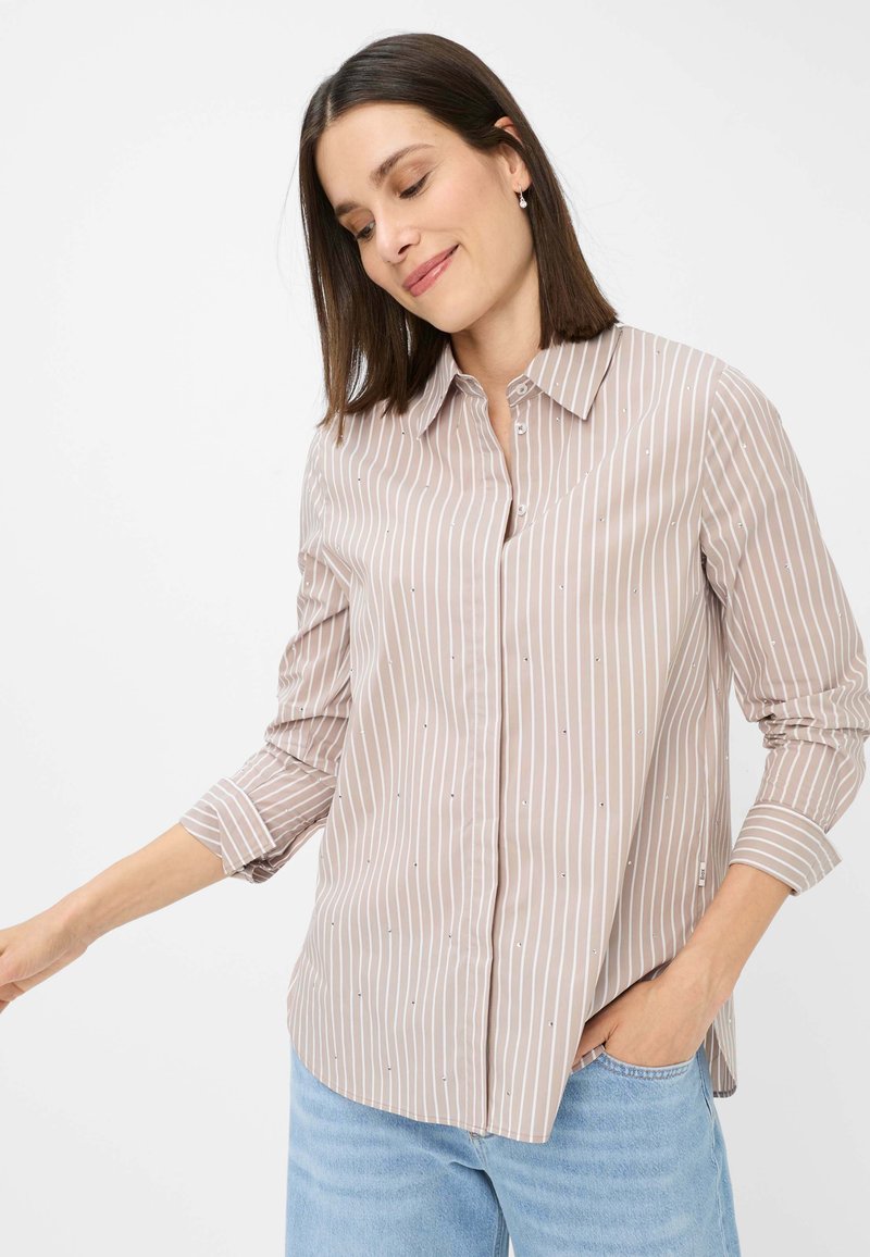 Striped beige blouse with a button-up front, long sleeves, and small embellishments. Fabric is lightweight, smooth, and slightly sheer.