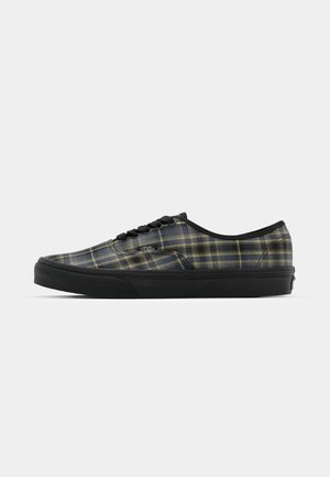 Svarta rutiga sneakers med överdel i texturerad tyg, snörning, vadderad sula och gummisula i svart.