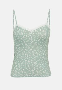 Lichtgroene cami met witte bloemenprint, kanten rand langs de halslijn, dunne verstelbare bandjes en drie kleine knoopjes aan de voorkant in het midden.