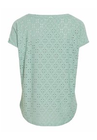 Blouse vert clair à manches courtes avec broderie florale ajourée et ourlet arrondi vue de dos.