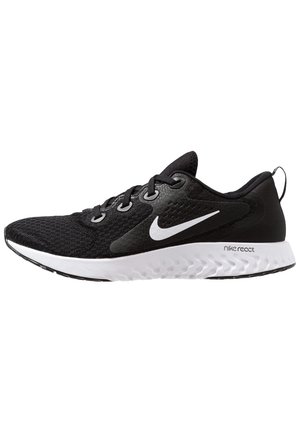 Chaussure de running Nike noire avec semelle blanche et logo swoosh, tige en maille, fermeture à lacets et marquage "Nike React" sur le côté.