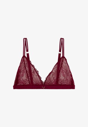 Bralette en dentelle bourgogne avec motifs floraux, bretelles doubles réglables et un petit charme en forme de V doré au centre du bandeau avant.