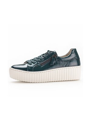 Green patent leather sneaker with a ribbed white platform sole, featuring lace-up closure and a side zipper for easy access.