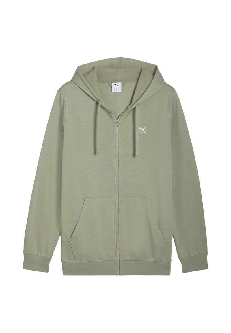 Grøn zip-up hoodie lavet af blødt stof, med en kengurulomme, justerbar hætte, og et lille logo på brystet.