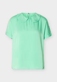Blouse à manches courtes vert menthe avec col rond Peter Pan et fermeture à boutons au dos, présentée sur un fond blanc.