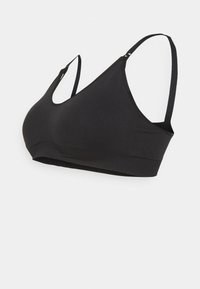 Svart bralette med justerbara band, sömlös design, rund halsringning och mjuk tygkänsla, lämplig för avslappnad användning.