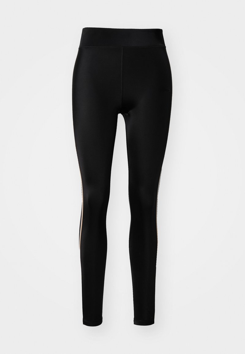 Leggings neri con vita alta e un tessuto liscio e elastico con accenti laterali a contrasto. Progettati per comfort e flessibilità.