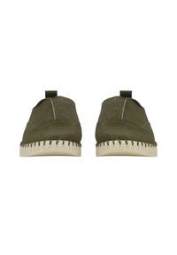 Olive green leather slip-on shoes with a minimalistic design, textured upper, and contrasting beige sole with stitched detailing.