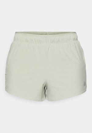 Lys grønne treningsshorts laget av pustende stoff, med perforert tekstur og elastisk liv. Logotrykk på siden.