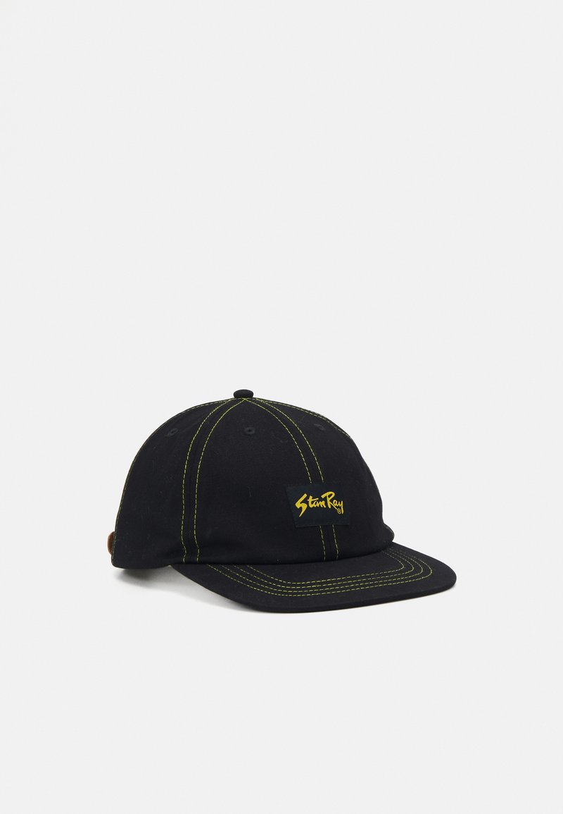 Black baseball cap made of cotton with yellow stitching. Features a square logo patch on the front and a curved brim.