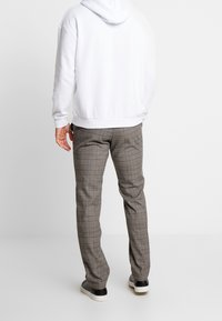 Pier One Trousers - mottled brown