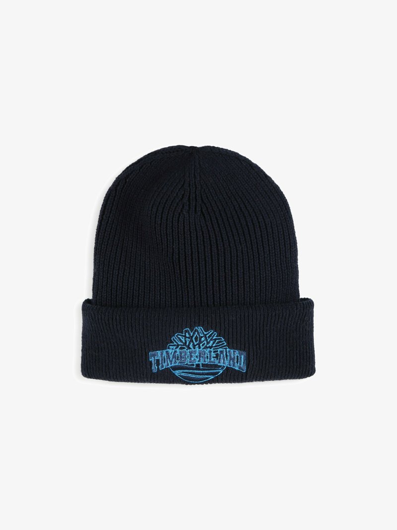 Chapeau en tricot noir avec un revers et un logo "Timberland" brodé en bleu. Présente une texture en côtes verticales.
