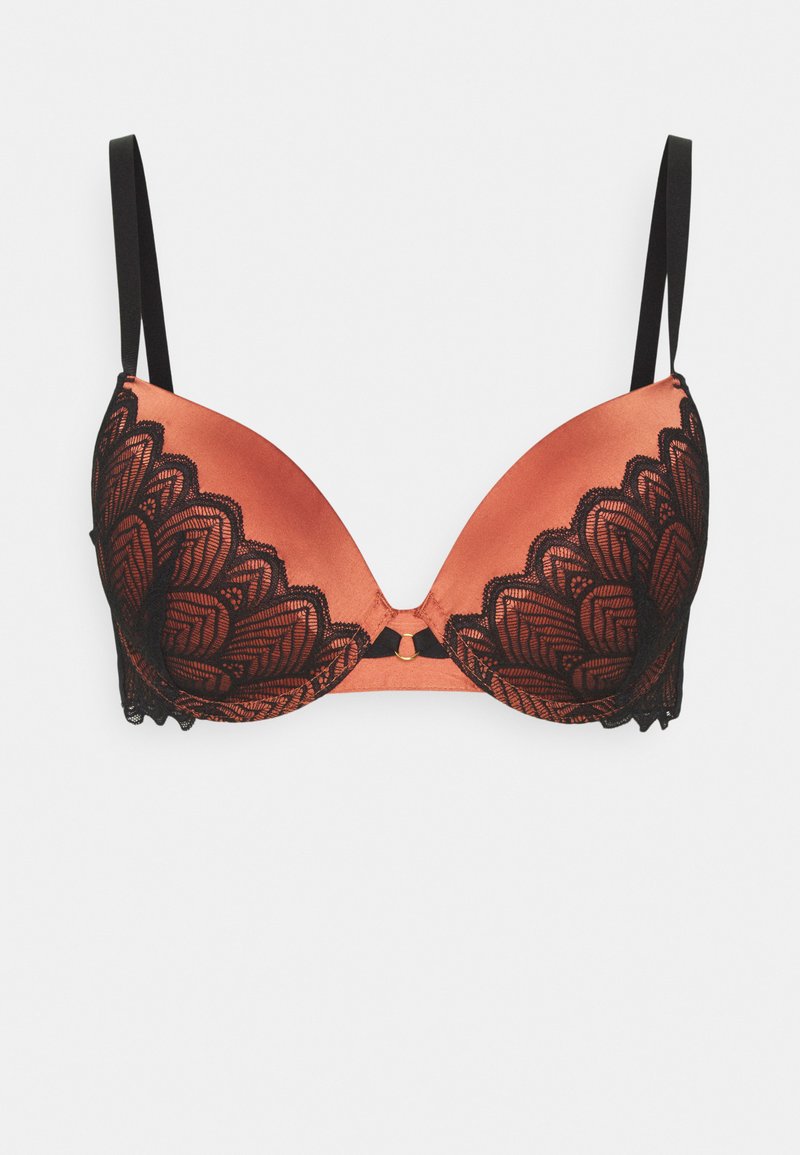 Soutien-gorge en satin couleur rouille avec un voile en dentelle noire mettant en avant un design festonné, des bretelles réglables et un matériel doré au centre.
