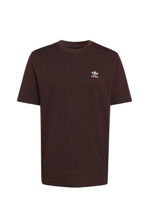 Hnědé bavlněné tričko s krátkými rukávy a kulatým výstřihem. Na hrudi je malé bílé logo Adidas. Klasický střih bez vzorů.