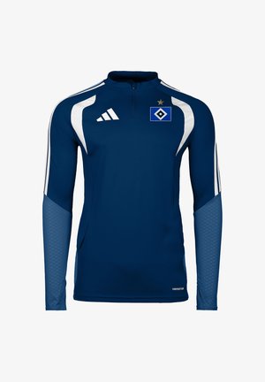 Granatowy sportowy top z długim rękawem, białe paski na ramionach, logo Adidas na prawej piersi oraz niebiesko-białe godło drużyny na lewej piersi.