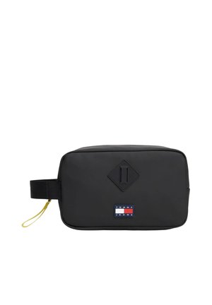 Bolsa de aseo rectangular negra con correa de muñeca y parche con el logo de Tommy Jeans en el frente, con un detalle cosido en forma de diamante.