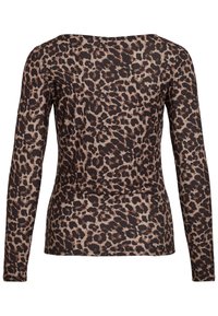 Haut ajusté à manches longues avec motif léopard marron et noir sur fond beige clair, vu de dos.