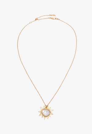 Delicate gold chain necklace with sun-shaped pendant featuring an irregular white pearl center.