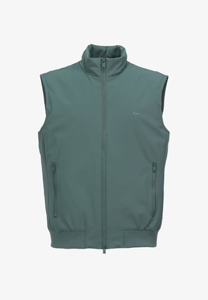 Veste sans manches en tissu turquoise avec une texture lisse, col montant, fermeture éclair frontale et deux poches latérales zippées. Soulignée par un ourlet côtelé.