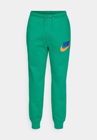 Nike Sportswear Teplákové kalhoty - green