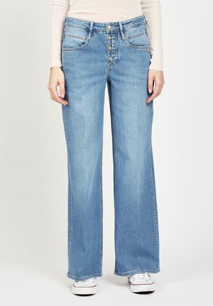 Light blue wide-leg jeans made from denim, featuring a button fly, five pockets, and contrasting stitching details.