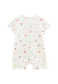 Combinaison en coton blanc à manches courtes, ornée de broderies florales en rose, jaune et bleu. Tissu léger et texturé.