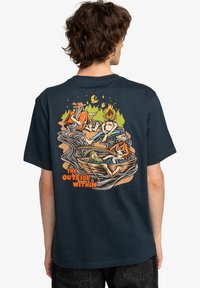 Navy blue cotton t-shirt featuring a colorful graphic on the back, depicting people in a boat surrounded by trees, fire, and mountains.