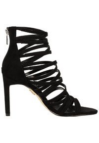 Sandale noire à talon haut avec plusieurs fines brides en suède entourant le pied et la cheville, avec une fermeture éclair à l'arrière.