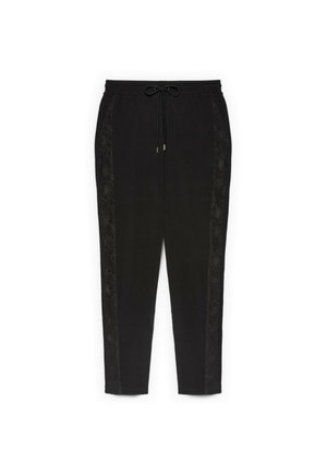 Czarne zwężane spodnie z elastycznym pasem i sznurkiem, z delikatnym kwiatowym haftem wzdłuż bocznych szwów.