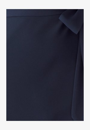 Navy fabric with a smooth texture, featuring a side bow detail. The material appears lightweight and soft, with a subtle sheen.