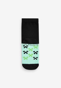 Sorte og mintgrønne sokker med pixeliserede designs i sort og grøn. Lavet af et blødt, strækbart materiale for komfort.