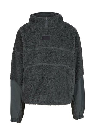 Fleece genser i mørk grå, med en myk tekstur, halv glidelås foran, hette, og kontrasterende matte stoffdetaljer på ermene.